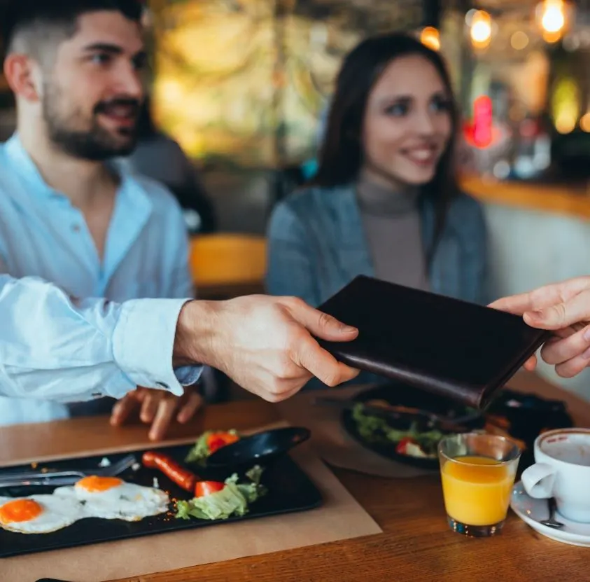 couple paying for food at a restaurant