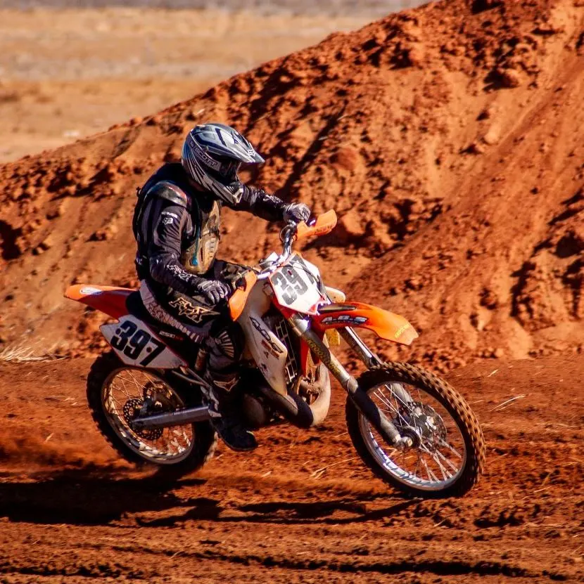 man on a motorbike in the desert