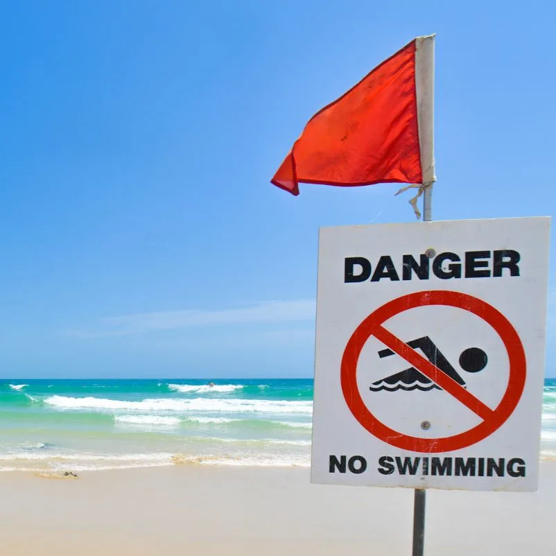 Red flag on a beach to show swimming is not allowed