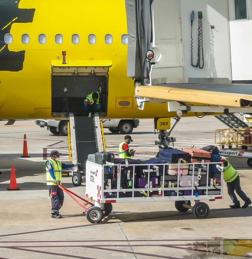 Spirit Airlines airplane being unloaded at Los Cabos airport