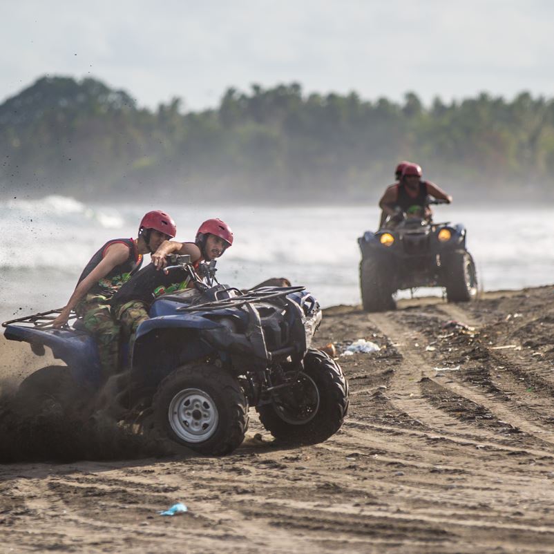 quad bikes in a large sandy beach area