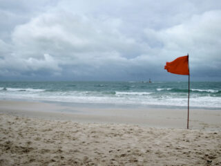 Red Flag on a windy day at the beach