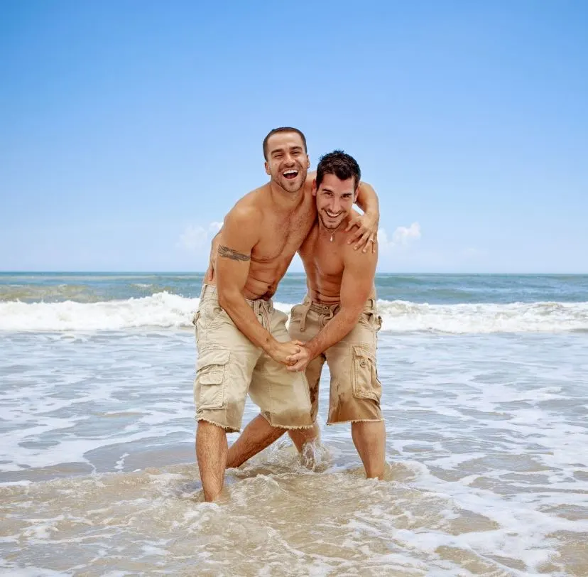 An LGBT couple on the beach