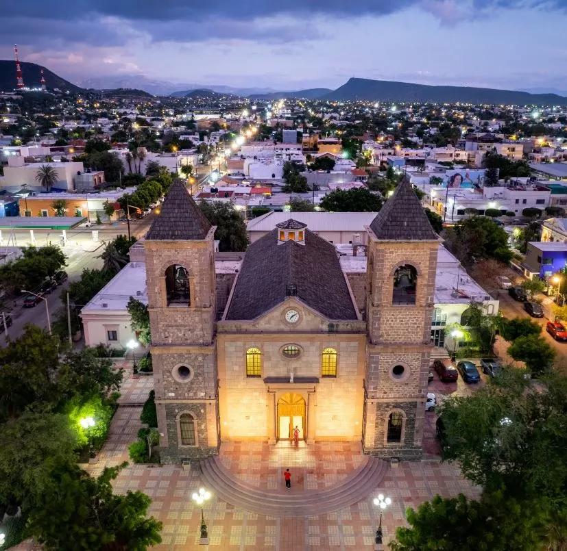 A view of La Paz cathedral at twilight with the city in the background