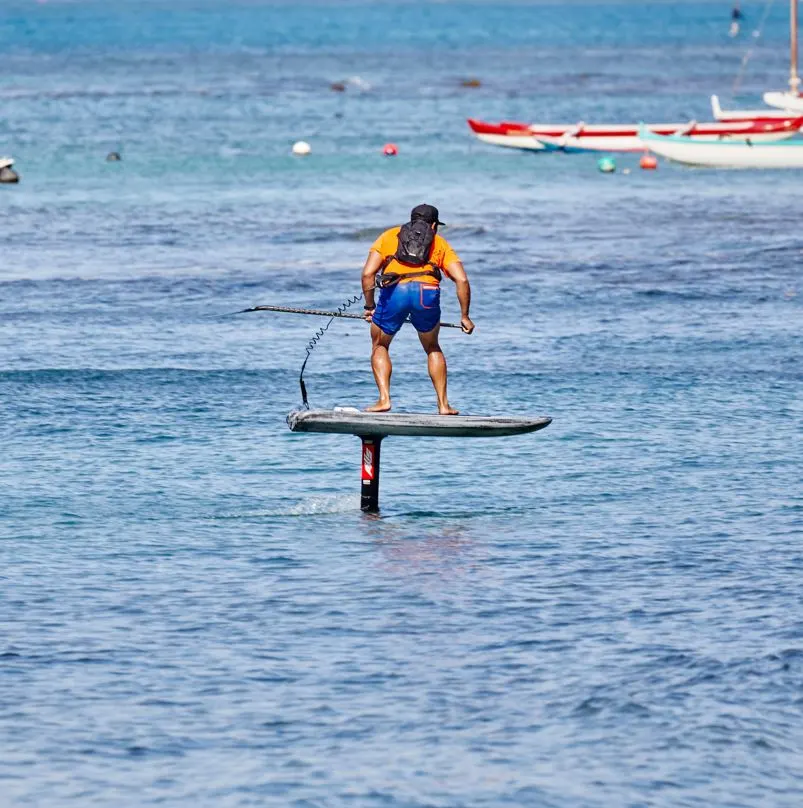 Man riding electric surfboard