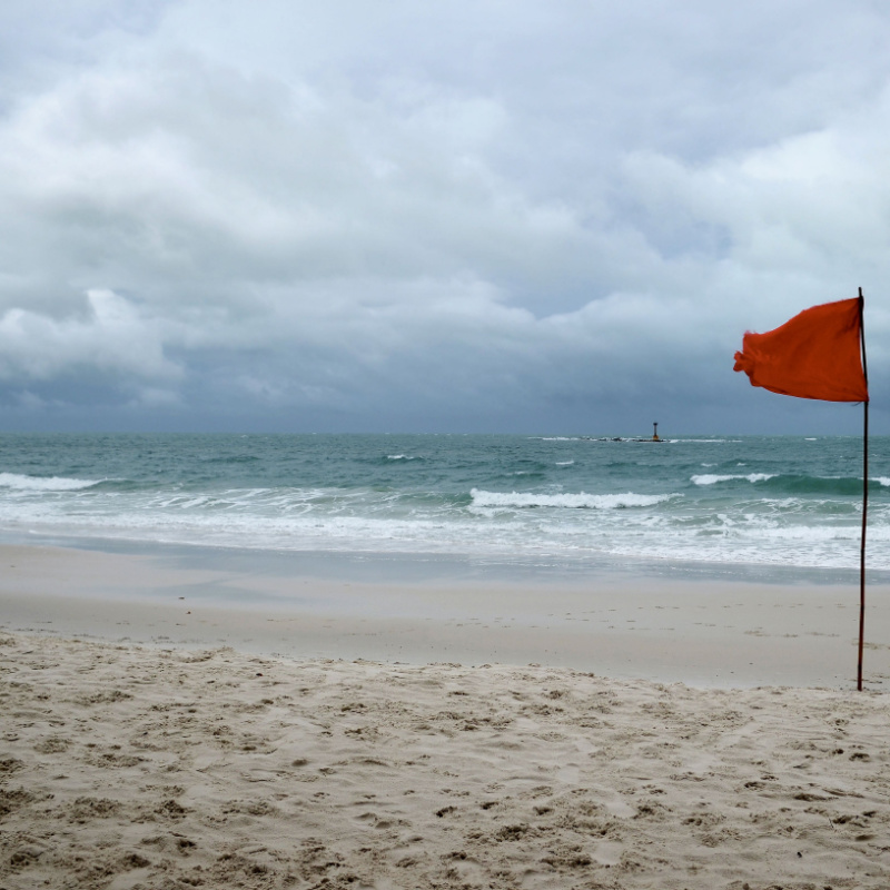 Red Flag on a windy day at the beach