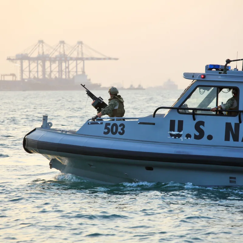 US Navy Boat Patrolling The Waters 