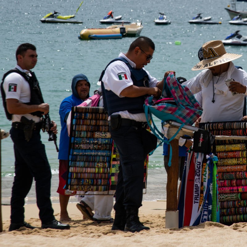 Police Patrolling a Beach in Los Cabos