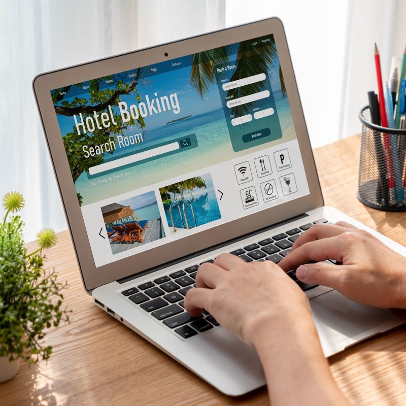 Hotel booking homepage on a laptop