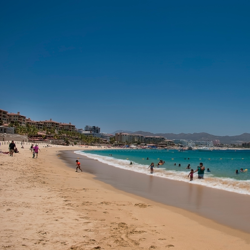 Tourists and Resorts on Medano Beach in Cabo San Lucas, Mexico