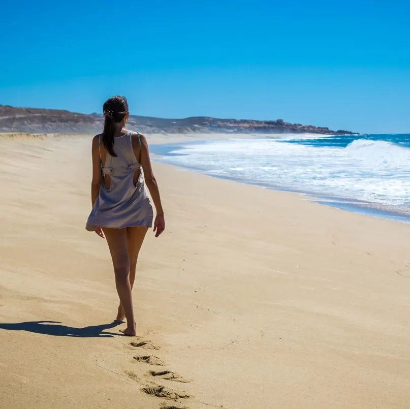 Woman walking on the beach in mexico