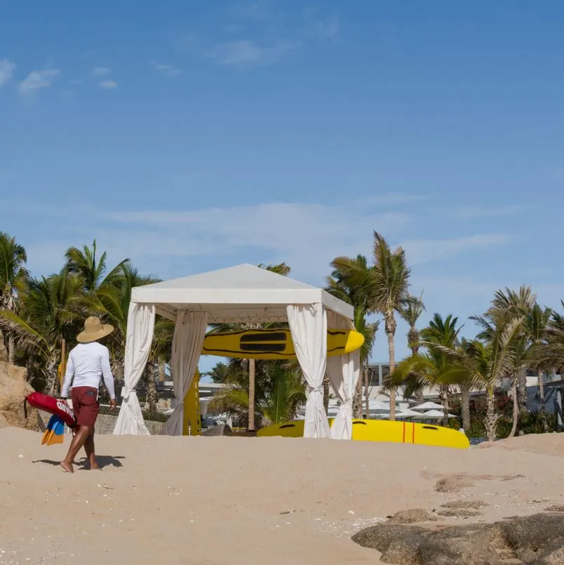 Lifeguard Walking Back To His Station In Los Cabos