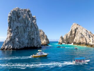 Los Cabos cruise around scenic tourist destination Arch of Cabo San Lucas, Playa Amantes, Playa del Divorcio and other scenic beaches.