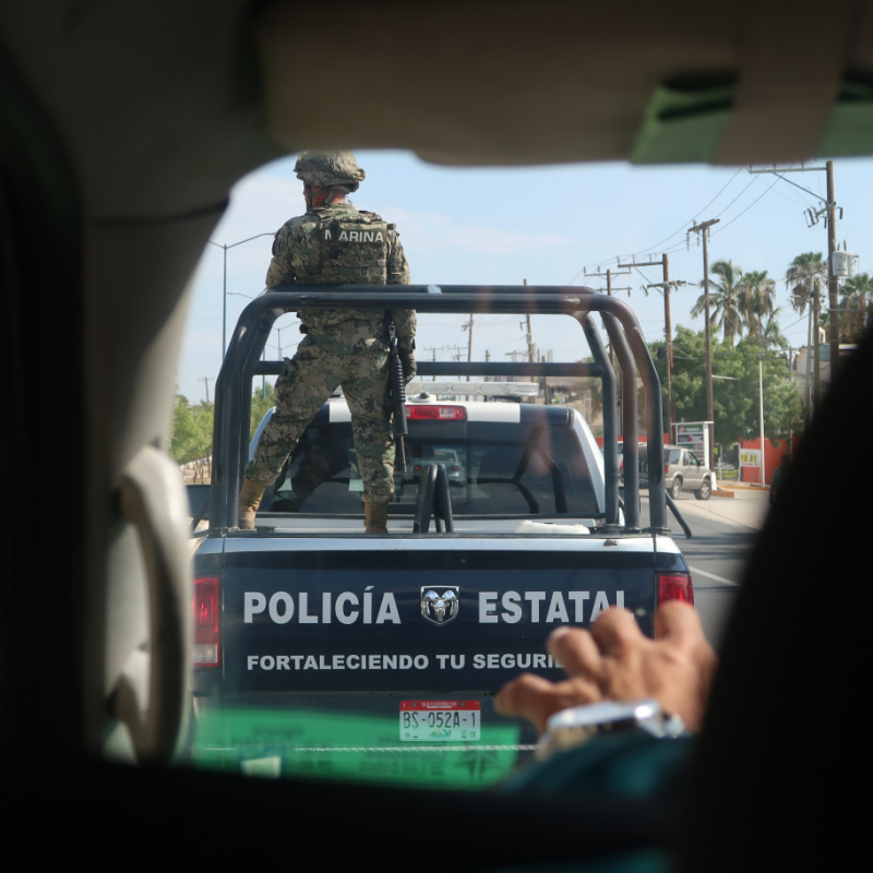 Police Vehicle Driving Down a Street in Los Cabos, Mexico