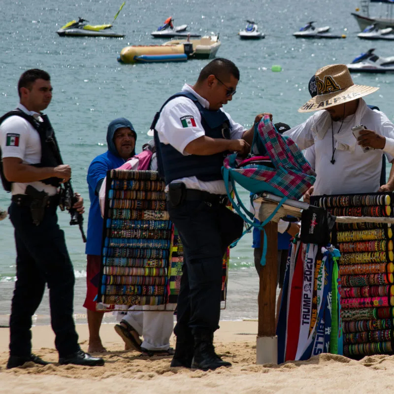 Police Checking the Bags of Vendors on a Los Cabos Beach