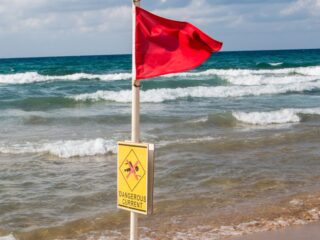Why You Should Never Ignore Beach Flags In Los Cabos