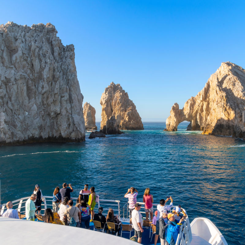 Tourists on a Boat Tour to the Arch in Los Cabos, Mexico