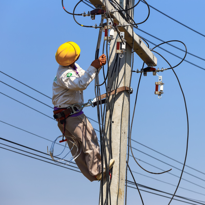 Worker Fixing a Power Line
