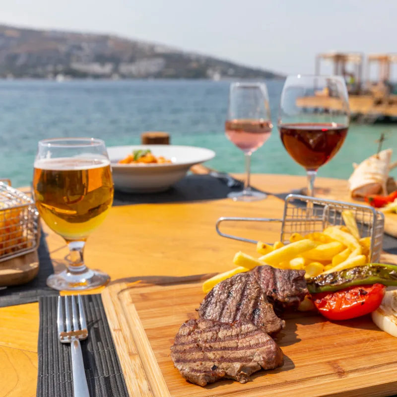 steak and wine at waterfront restaurant