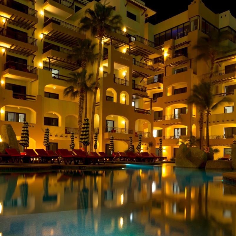 A los cabos resort pool and building at night