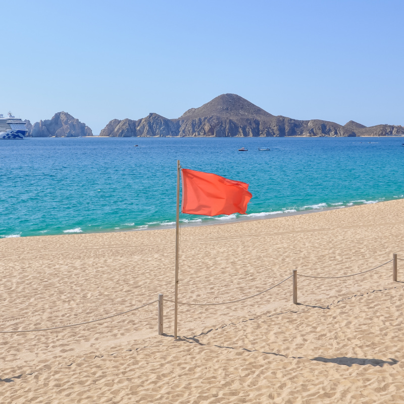 Red Warning Flag on a Beach in Los Cabos, Mexico