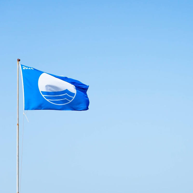 blue flag on beach