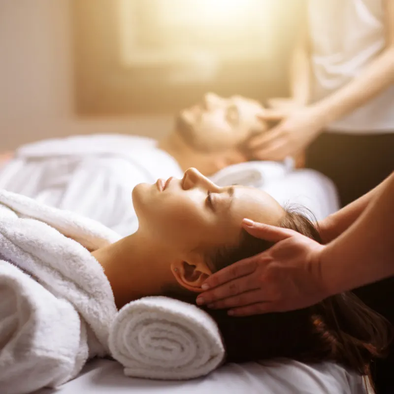 couple at spa getting head massage