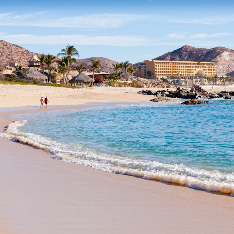 couple walking alone on Cabo beach