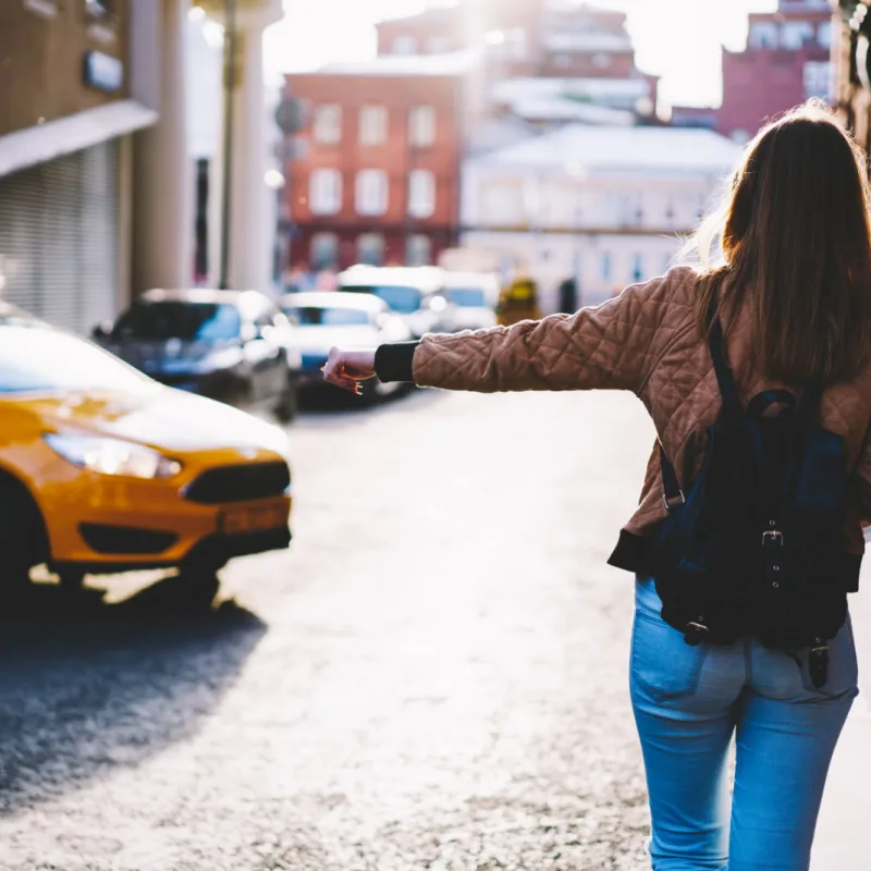 female traveler hailing a cab