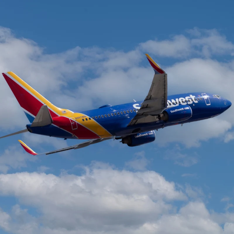 southwest plane flying in blue sky
