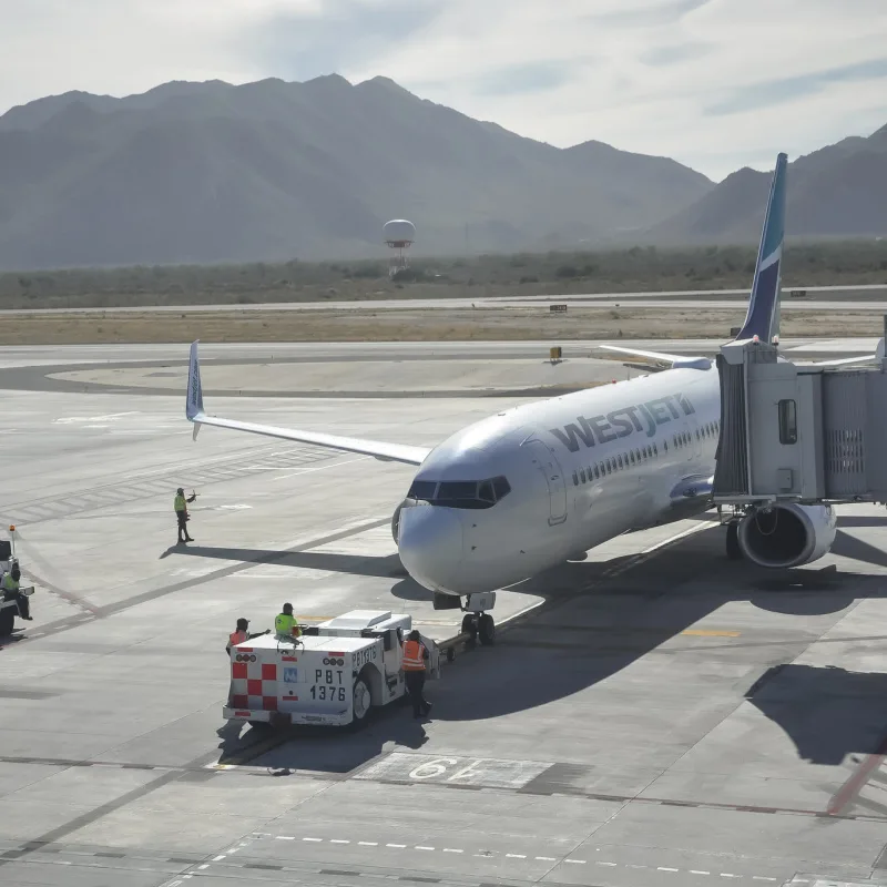 WestJet plane parked at Los Cabos International Airport