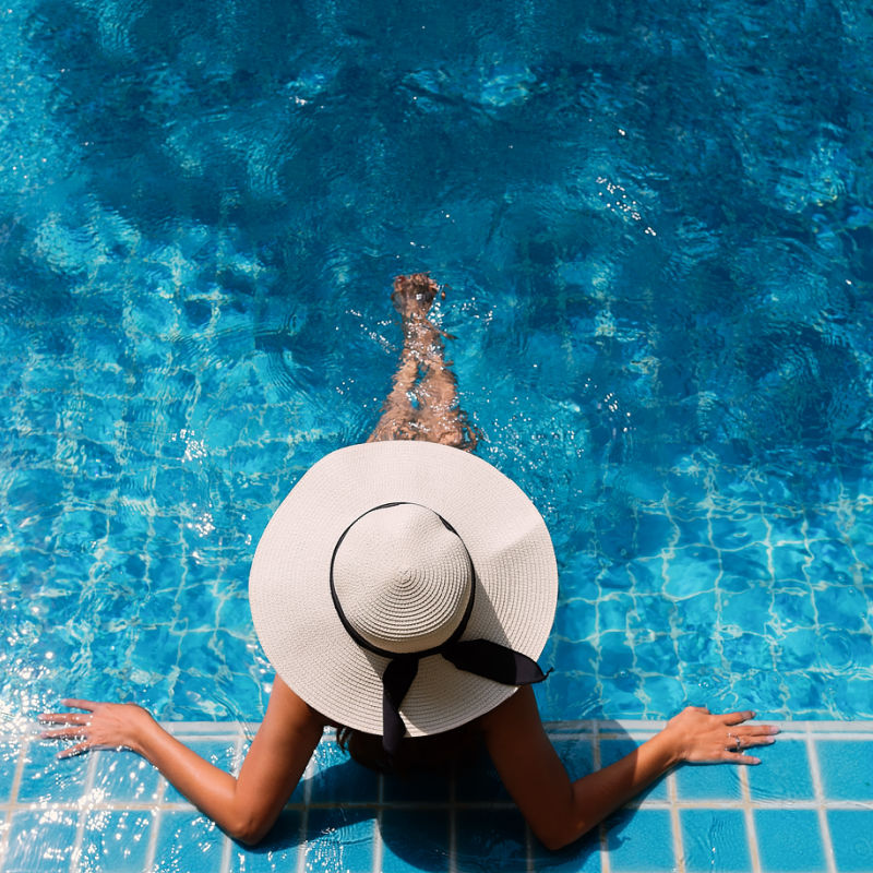 woman in pool at resort