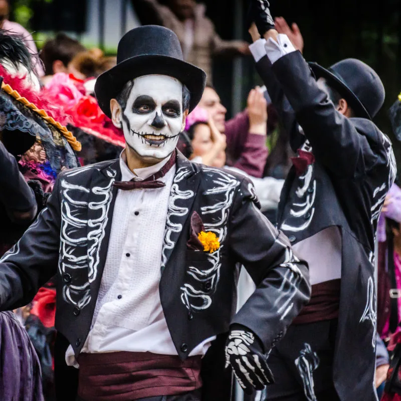 Man wearing a costume for Los Dias de los Muertos