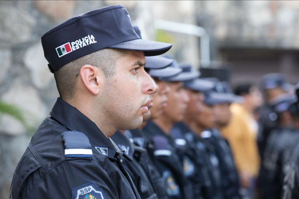 Mexican police officers standing guard.