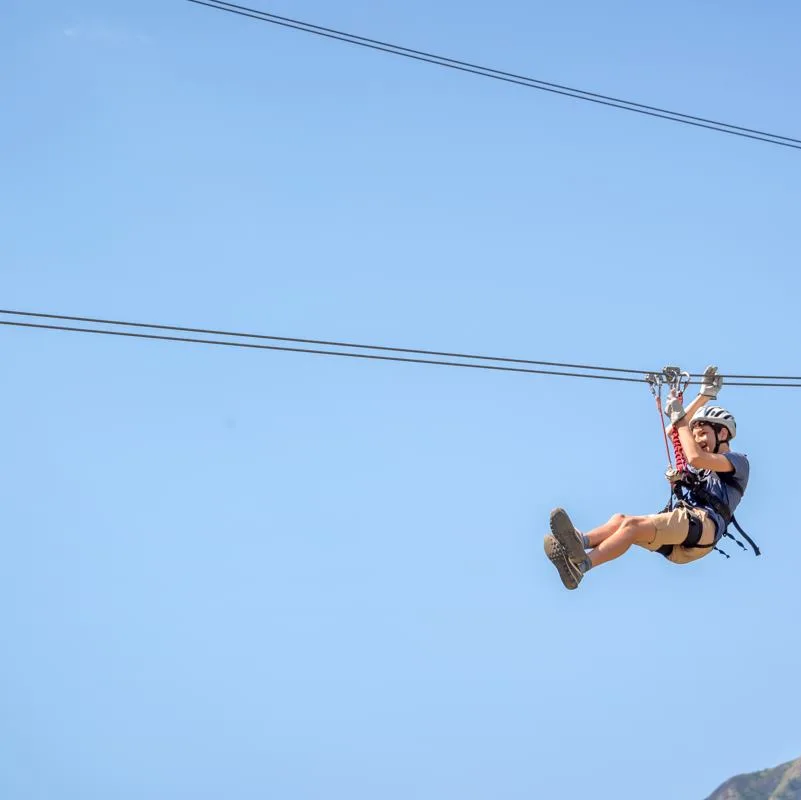 A young teen on a zipline