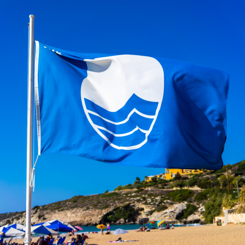 blue flag on beach