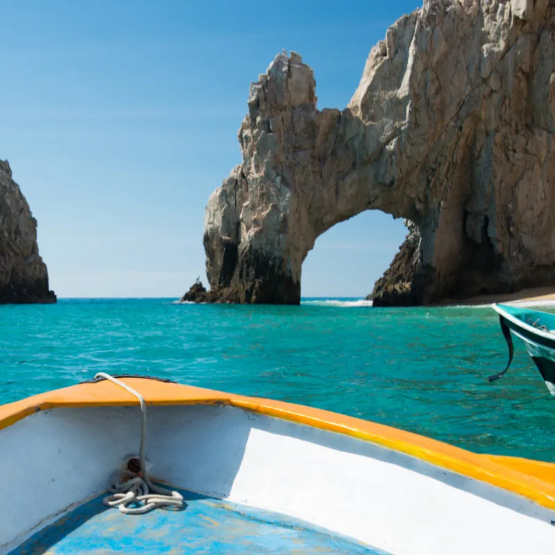 head of boat at the arch in cabo