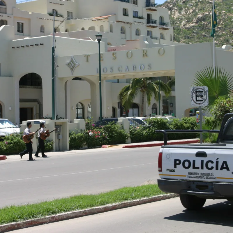 A police truck parked outside of a resort in Los Cabos