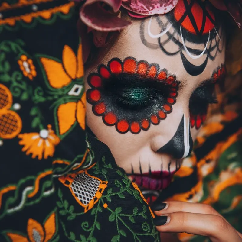 A woman with sugar skull style make up