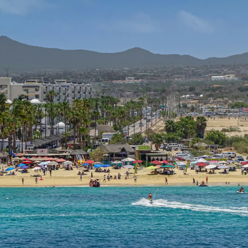 Tourists on a beach in Los Cabos