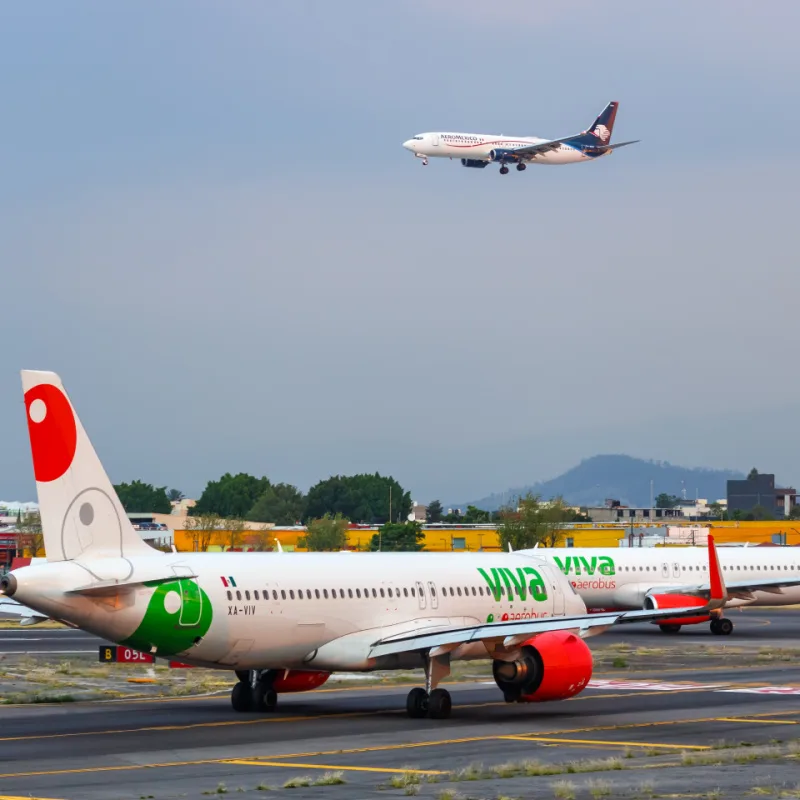 Aeromexico and Viva Aerobus airplanes at an airport