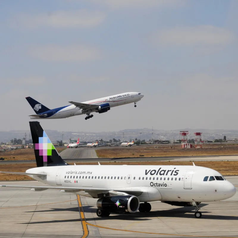 Volaris and Aeromexico planes at an airport