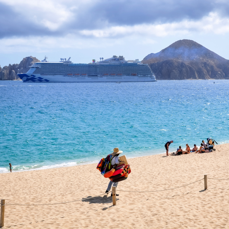 Cabo San Lucas, Mexico - Scene at the beach of Playa Medano in Los Cabos in a beautiful sunny day with a beach vendor
