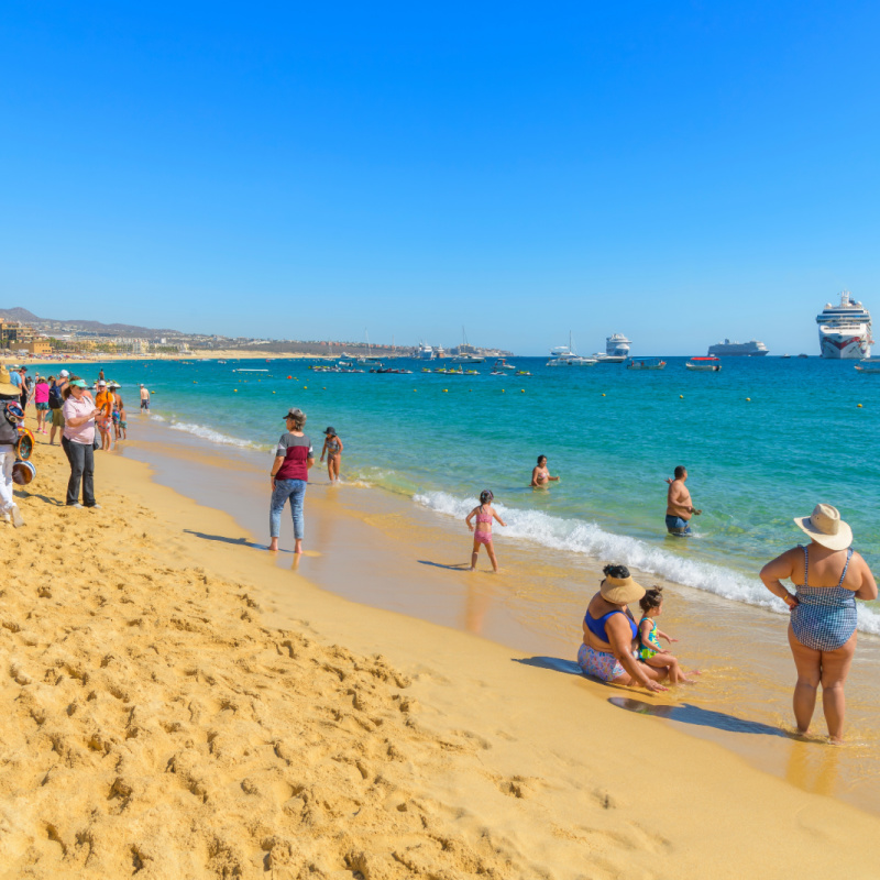 People on the beach in Los Cabos