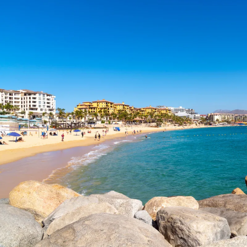 Sunny hot day at the Playa Pública public beach at the resort town of Cabo San Lucas, Mexico.