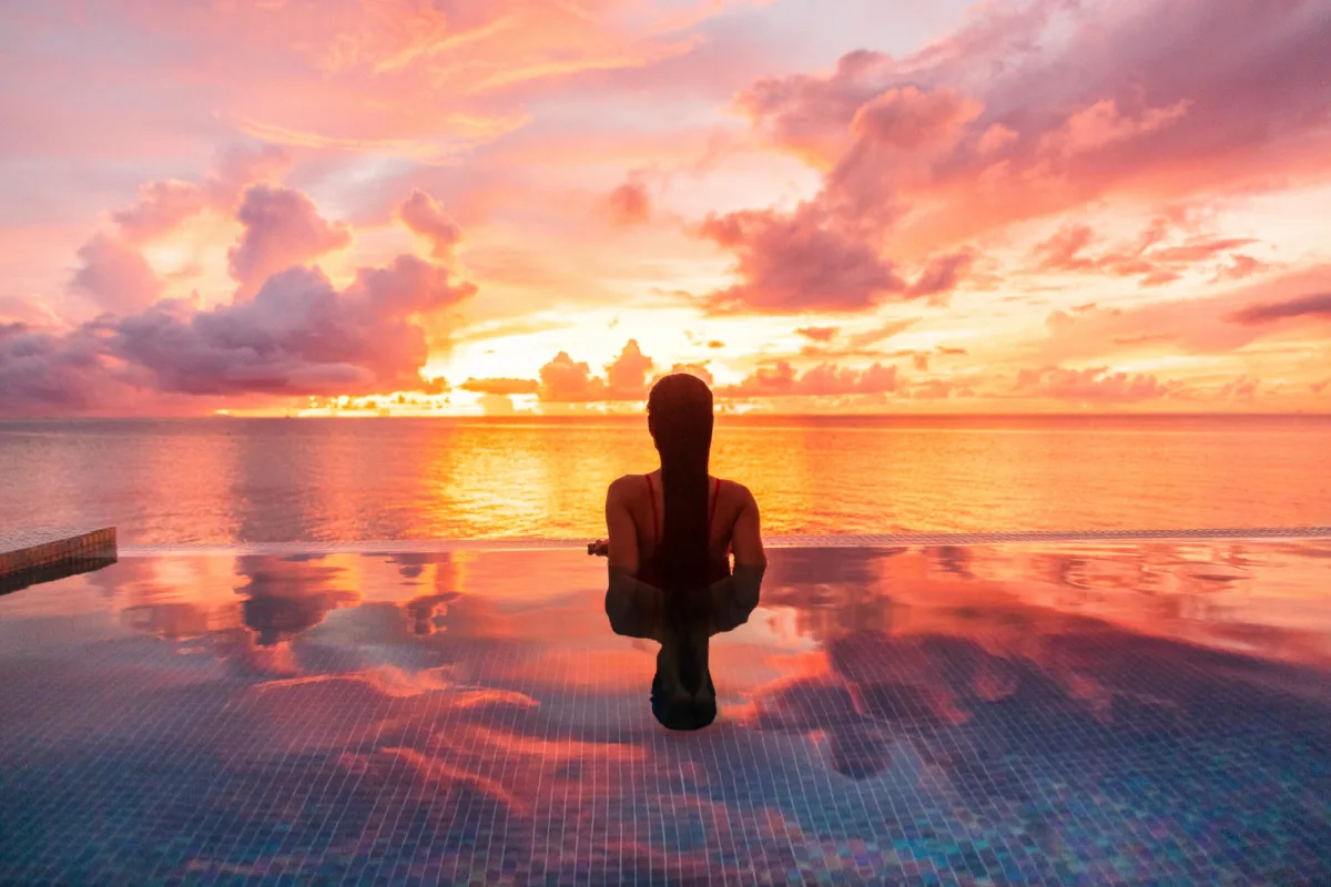 female tourist in infinity pool