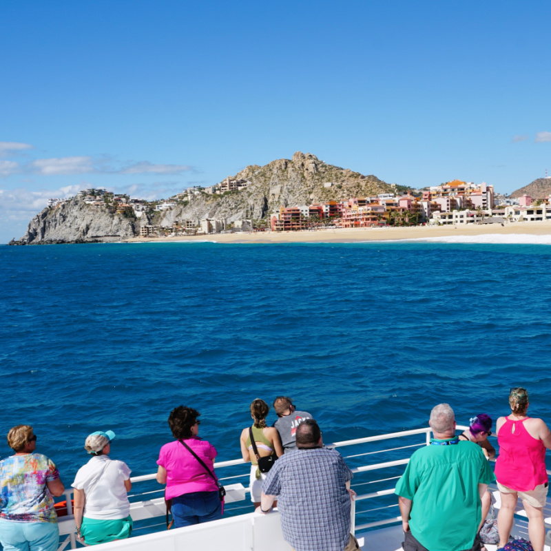 tourists on a boat in cabo