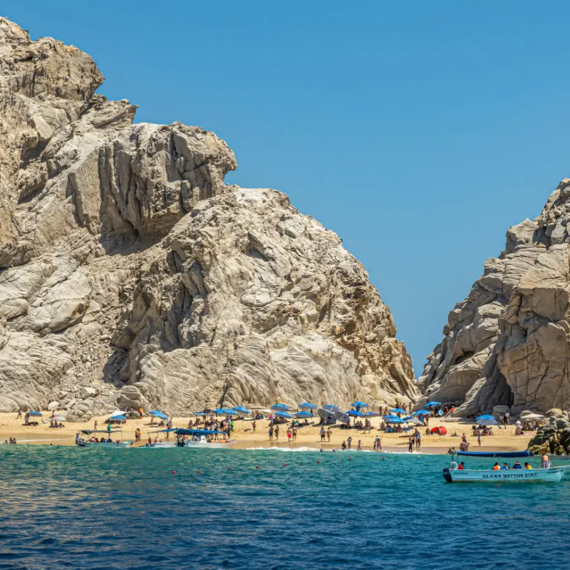 tourists on beach in los cabos