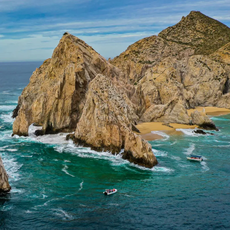 A 4k Aerial view of cliffs and beaches in Cabo San Lucas