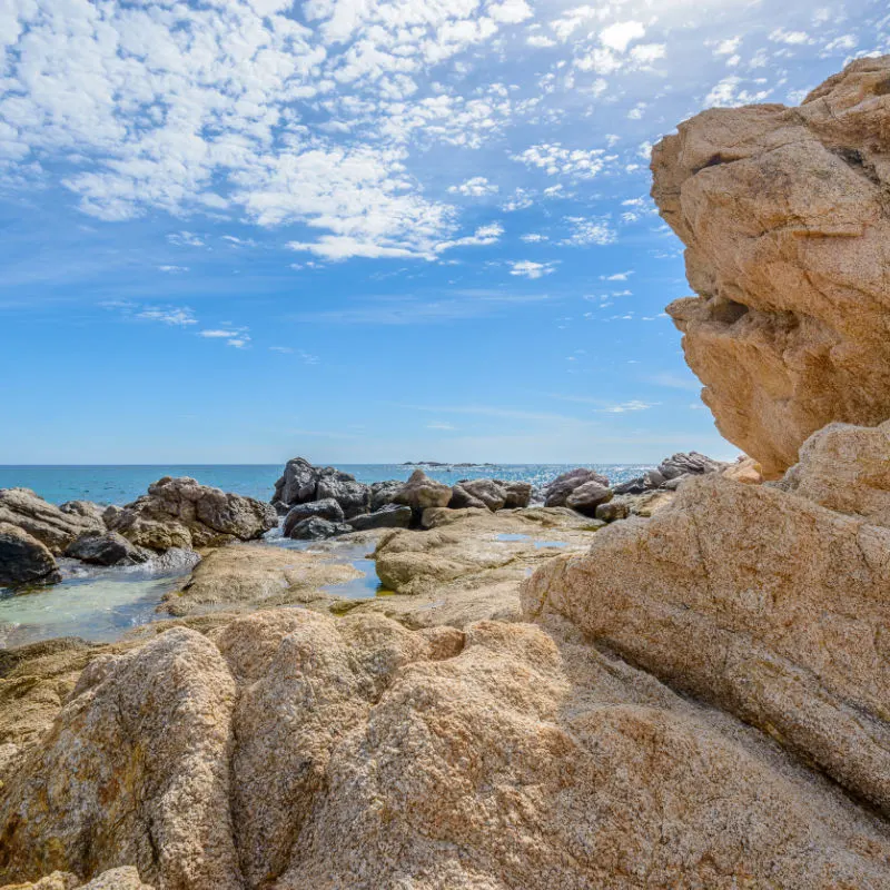 Rocks on El Chileno beach on a sunny day in Los Cabos